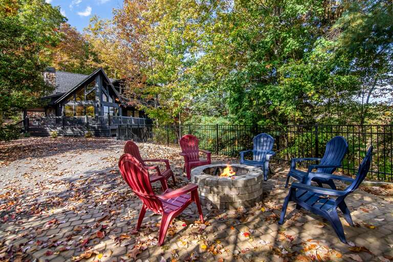 Chairs Circle Crackling Firepit Amidst Colorful Autumn Leaves