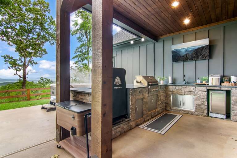 Outdoor Grill Gazebo With Stone Counters And Scenic View