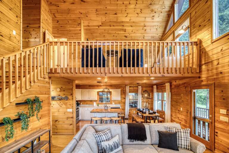 Living room w/ view of kitchen and dining area 