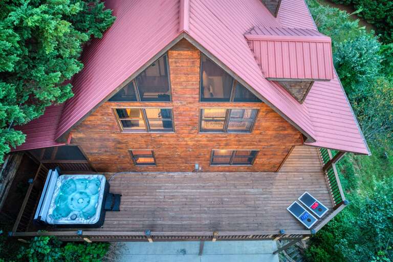 Aerial view of hot tub and corn hole boards