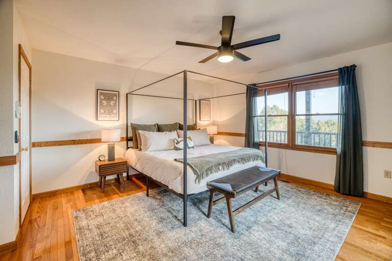 Master bedroom w/ wall of windows