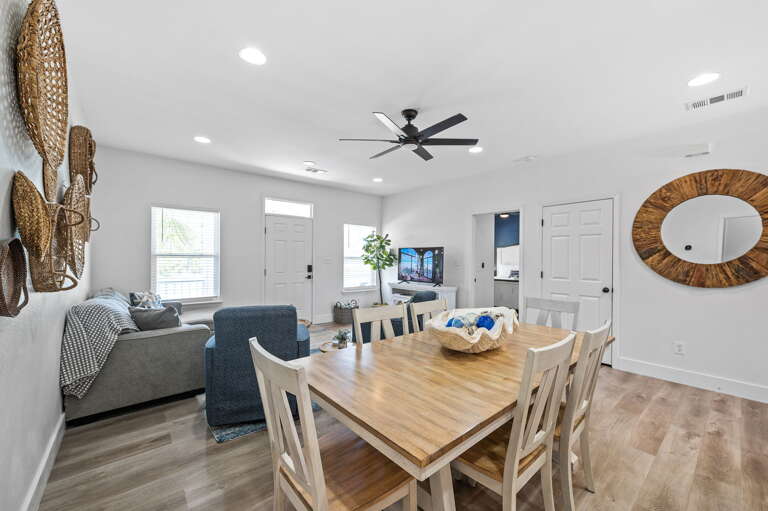This elegant dining area is the perfect place to gather with family and friends. The space boasts a large dining table that can comfortably seat six people, making it perfect for hosting dinner parties and special occasions.