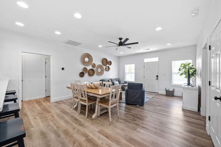 This elegant dining area is the perfect place to gather with family and friends. The space boasts a large dining table that can comfortably seat six people, making it perfect for hosting dinner parties and special occasions.
