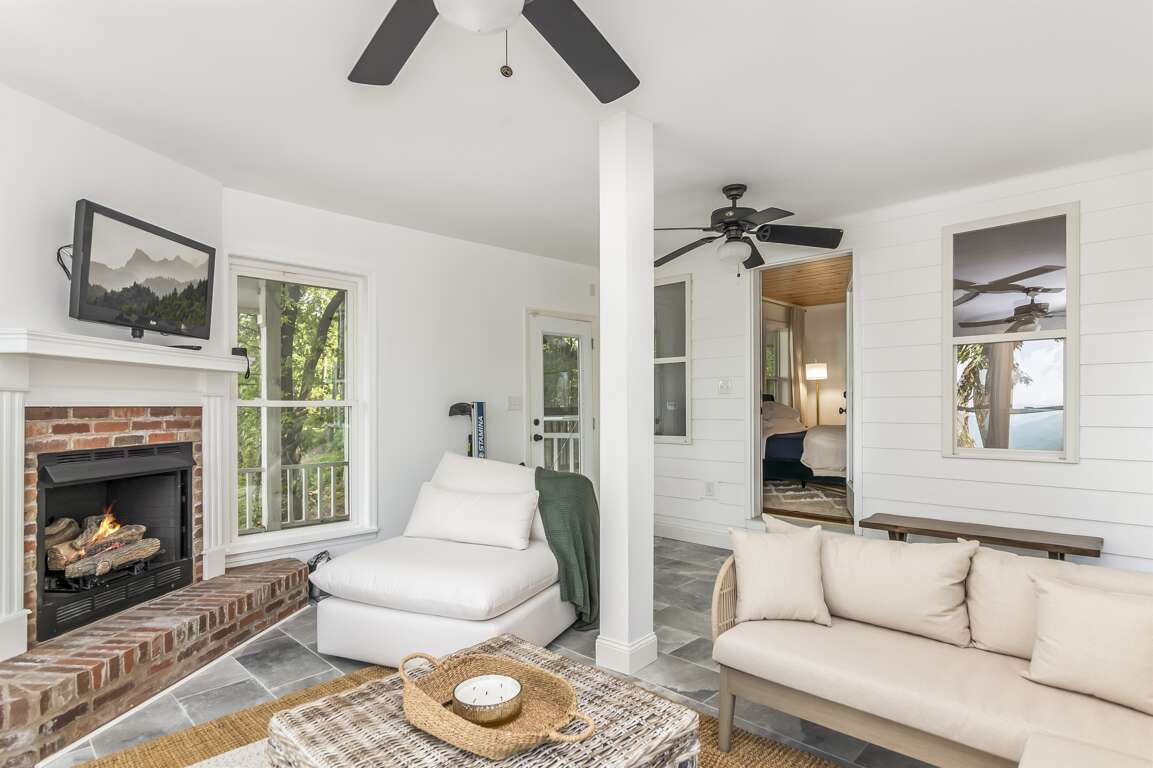 Secondary living room in basement w/ fireplace and smart TV Secondary living room in basement w/ fireplace and smart TV