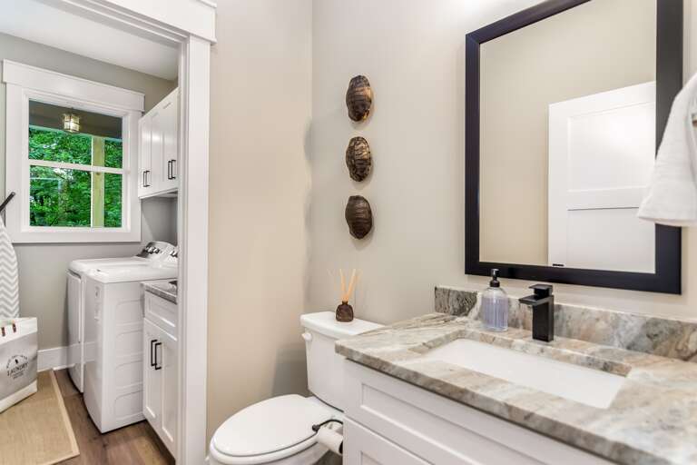 Half bathroom and laundry room connected 