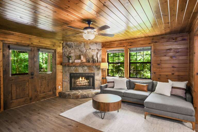 Inviting living room w/ L shaped couch and gas fireplace Inviting living room w/ L shaped couch and gas fireplace
