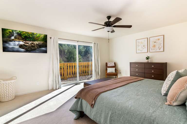 Master bedroom w/ large Smart TV