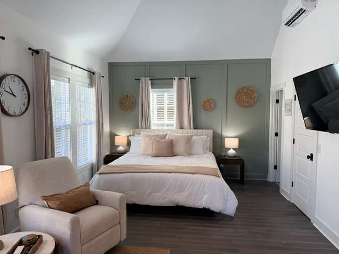 Warm up to this cozy king size bed w/ black out curtains 