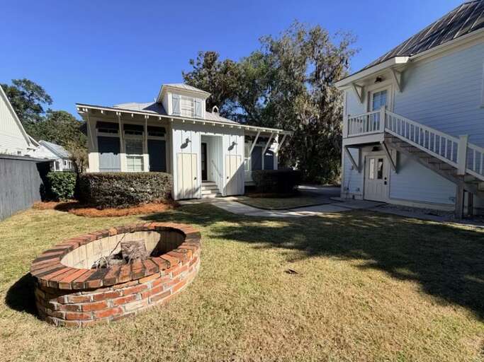 Firepit area w/ views of the main house and carriage house 
