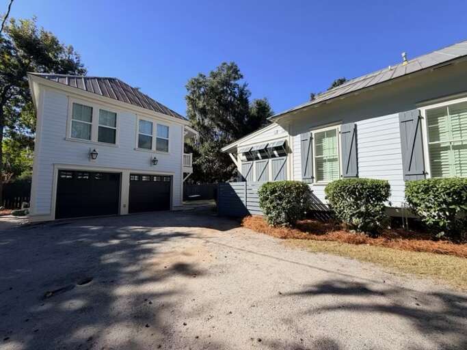 Parking area - Garage is for storage only and not for guest use