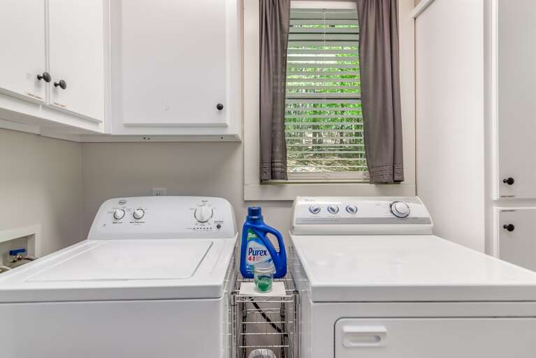 Wonderful and spacious laundry area equipped with an iron and board if needed.