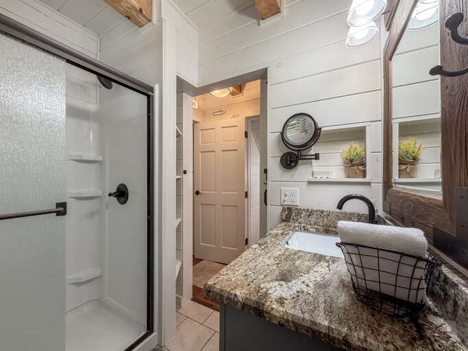 Full bath with a stand-up shower, and convenient for all to access.