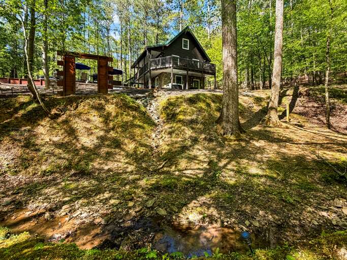 A serene waterfront retreat with stream views. Perfect for rest, restoration, and meaningful moments.