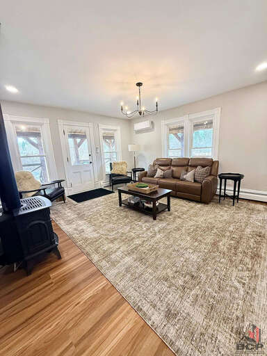 Living room w/ wood burning stove 