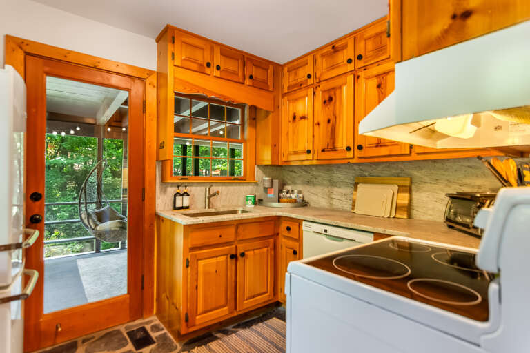 Kitchen and door leading to the screened porch 
