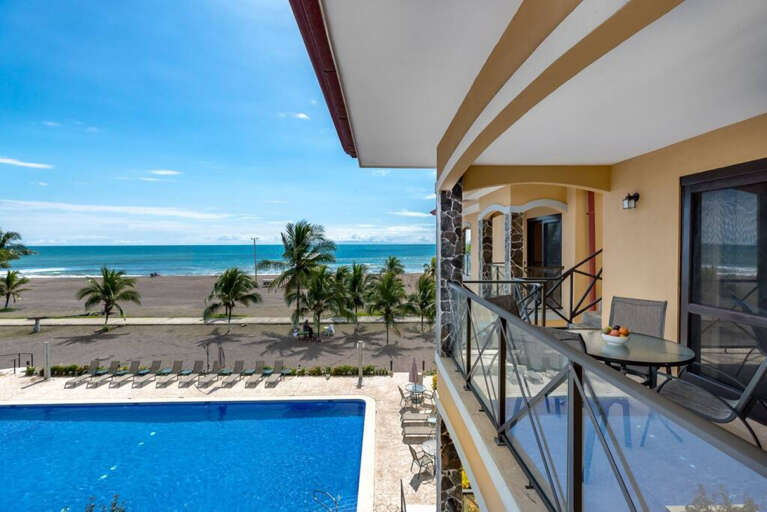 A view from another one of our 3 balconies.  This one is off the Living Room with a great view of the 3-tier pool and the beach.