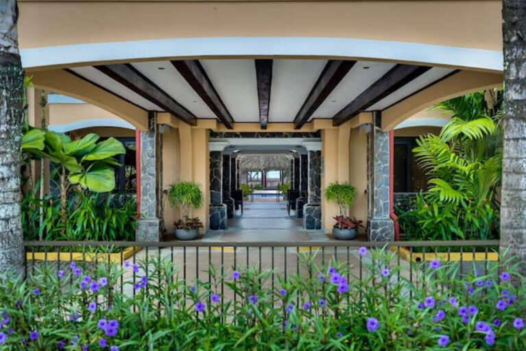 Entrance to Bahia Encantada courtyard and pool from parking lot.
