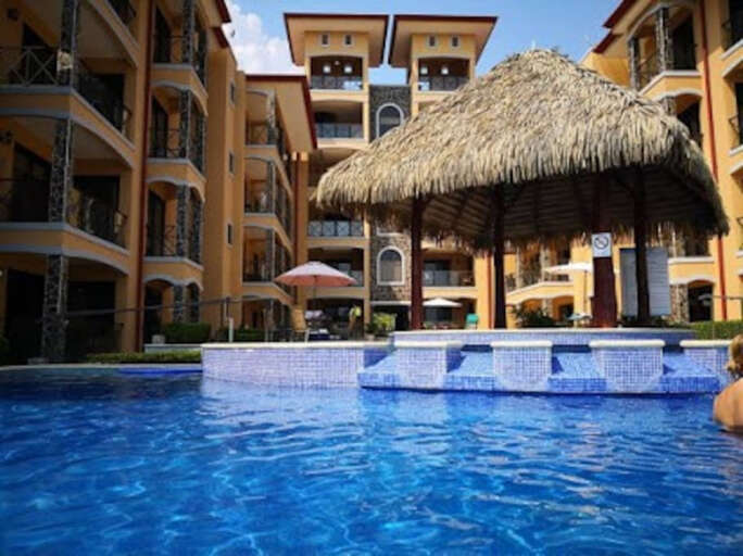 Swim up bar with in-water bar stools.  The bar is self-service/use.
