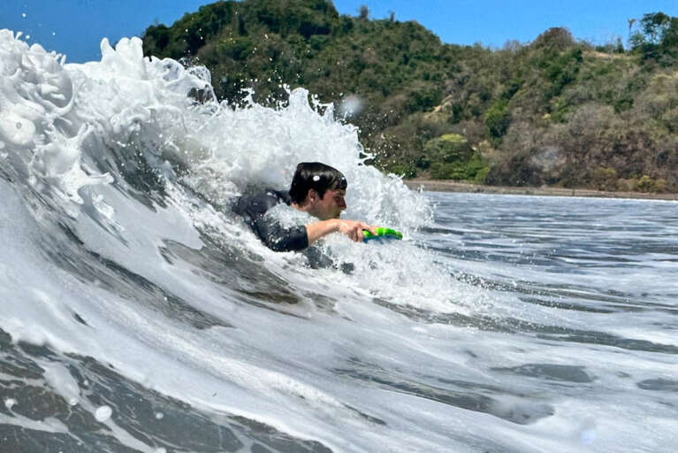 Boogie boarding with provided boogie boards.
