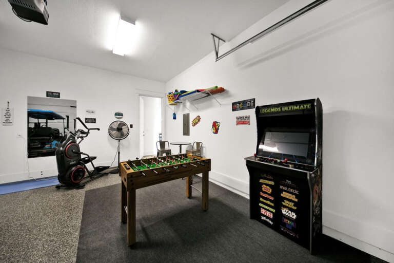 Game area with Video games and Foosball in Garage