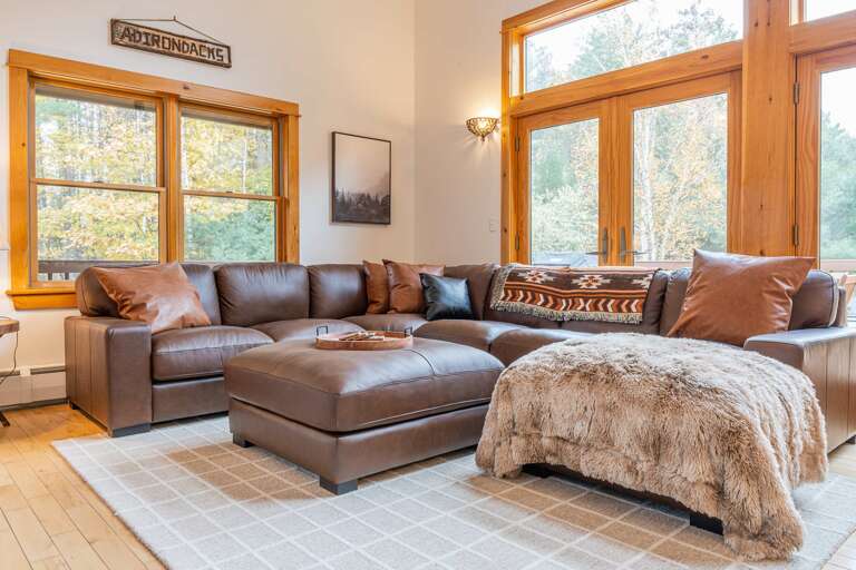 Sunlit Space Showcasing Sofas, Sizable Windows, And Subtle Decor