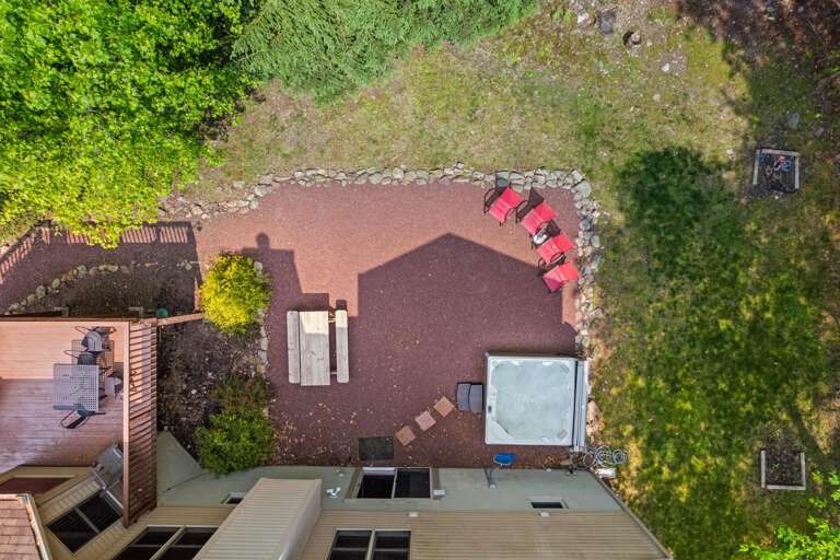 Aerial View Of Patio With Chairs, Table, And Jacuzzi