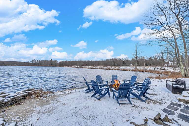 Chairs Circled By Snowy Shore, Serene Sky Shades, Slight Flame Flickers