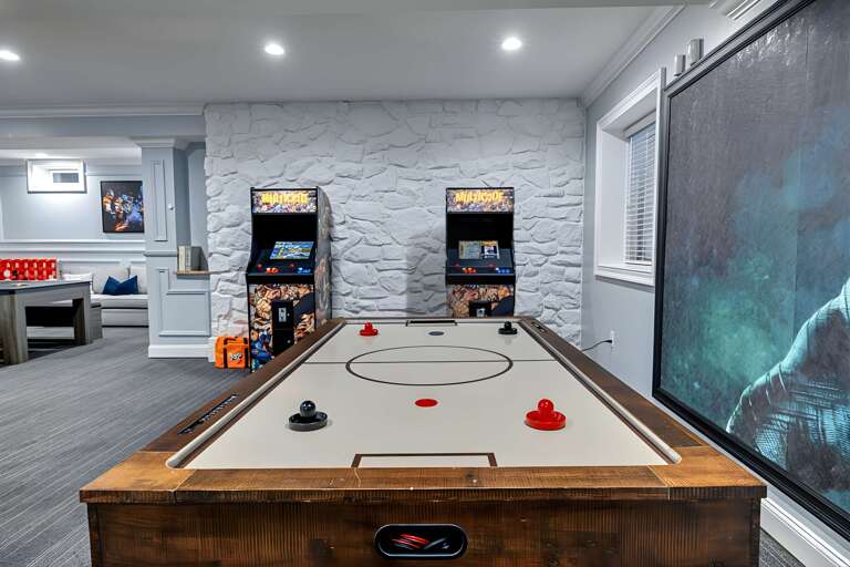 Game Room With Air Hockey And Arcade Machines