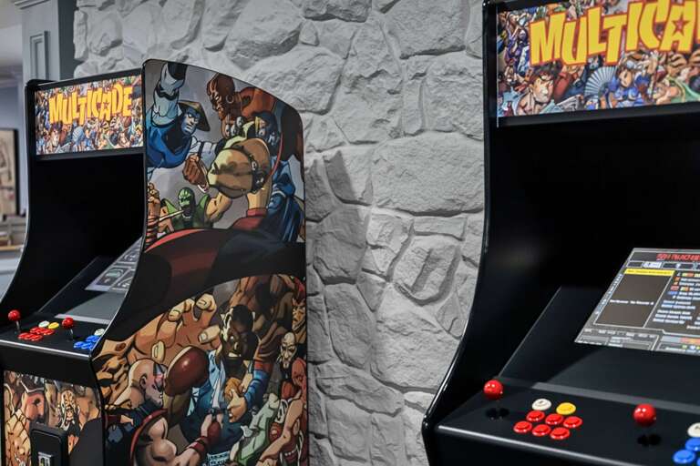 Arcade Machines Against A Stone Wall