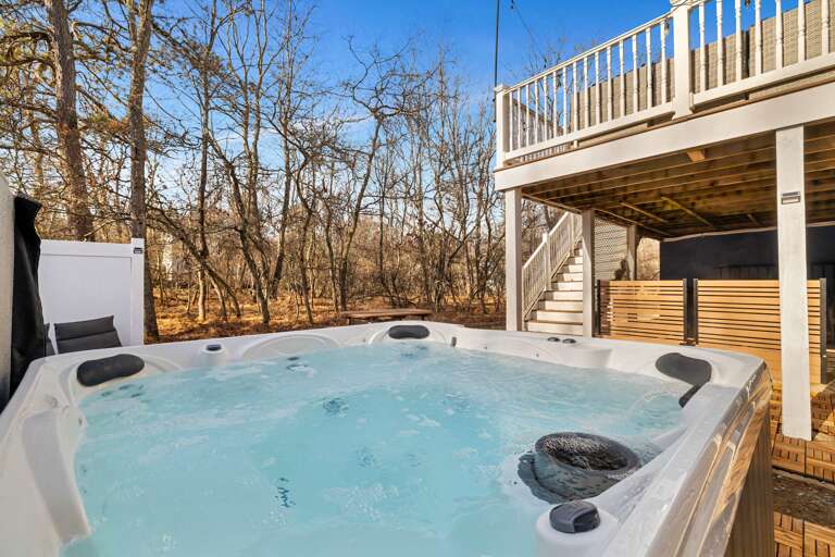 Bubbling Bath Beneath Balcony, Bare Branches Beyond