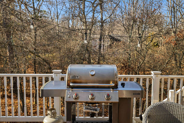 Grill Gleaming On A Sunlit Suburban Deck
