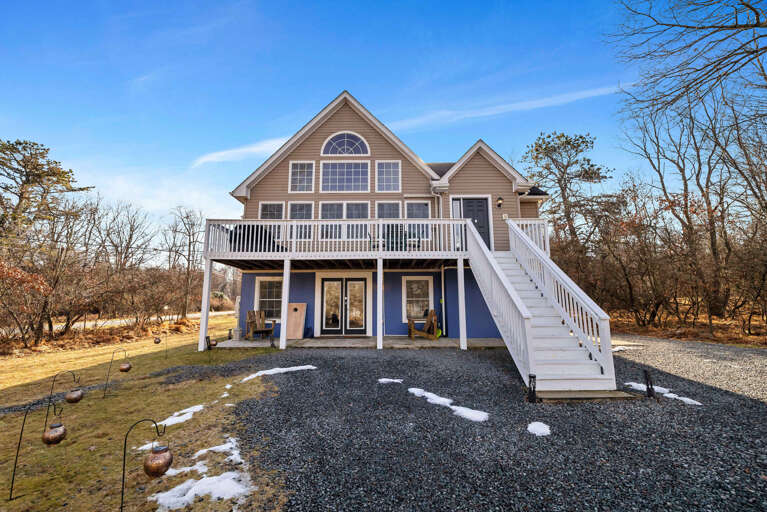 Blue-sky Backdrop Behind A Broad Balcony Vacation Rental