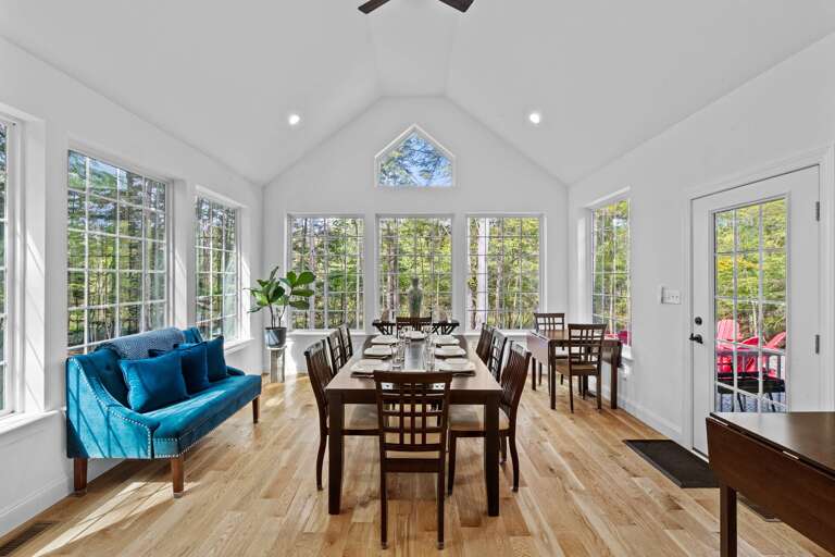 Spacious Sunlit Dining Area With Forest Views