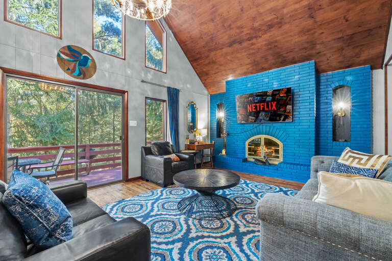 Chic Chalet Living Room, Vaulted Ceiling, Blue Brick Fireplace, Plush Seating