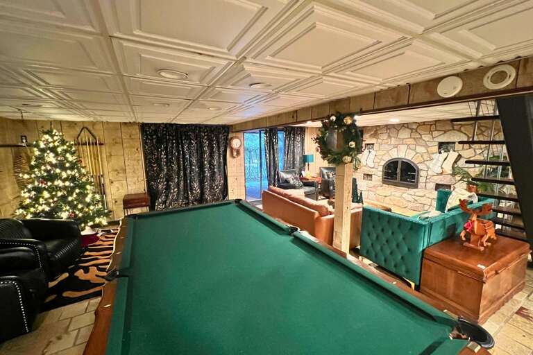 Green Billiards Table, Festive Tree, Plush Seating, Panelled Walls