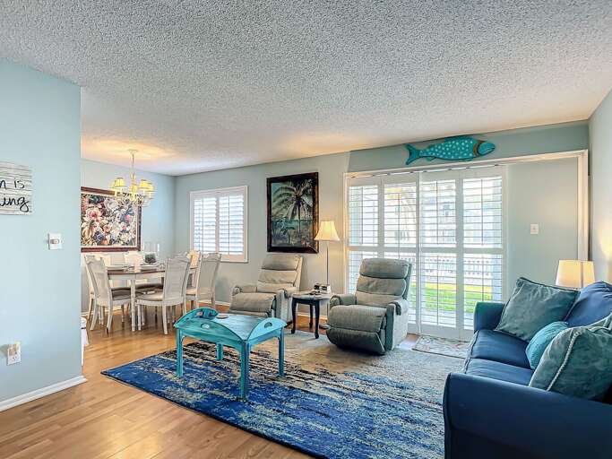 Bright and inviting living space seamlessly connected to the dining area, perfect for gatherings.