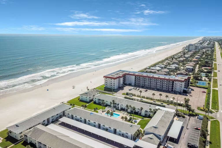 Enjoy the expansive beauty of this oceanfront property, offering direct beach access and stunning