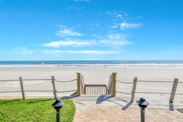 Step directly onto the pristine sandy beach from this peaceful oceanfront spot, offering