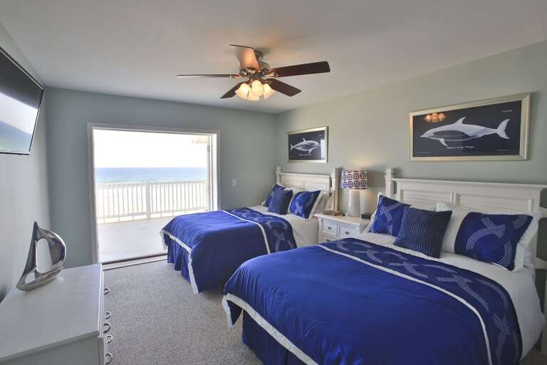 Seaside Twin Beds In A Breezy Room With Balcony Overlooking The Ocean