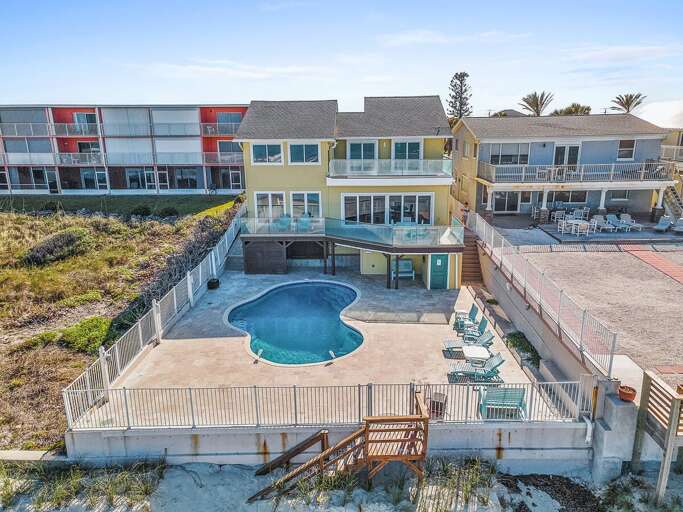 Beautiful oceanfront beach stay featuring a private pool, spacious patio, and direct beach access.