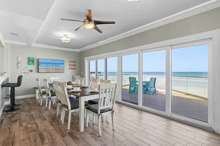 Dine with a view in this bright oceanfront dining space with large sliding doors to the balcony.