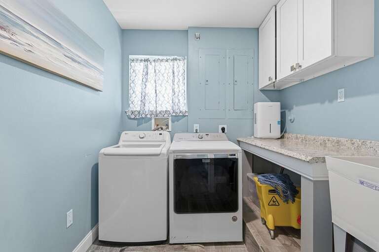 Enjoy the ease of an in-unit washer and dryer during your beach stay. This bright laundry space makes it simple to keep clothes and beach towels fresh after long days by the ocean.