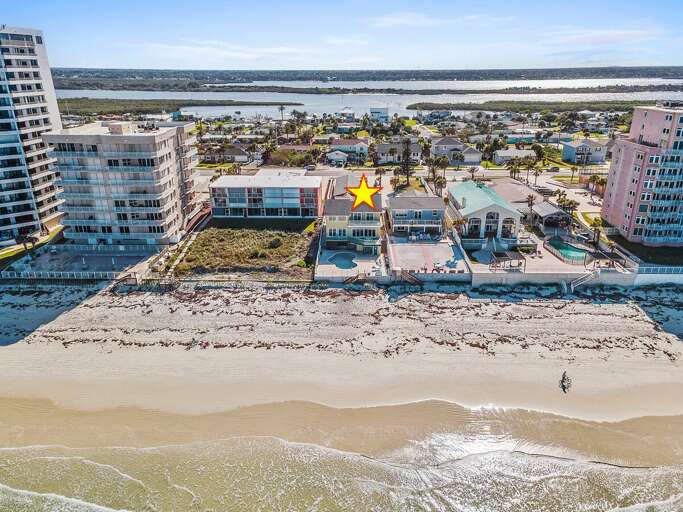 Prime oceanfront beach stay highlighted for location, offering direct beach access and stunning