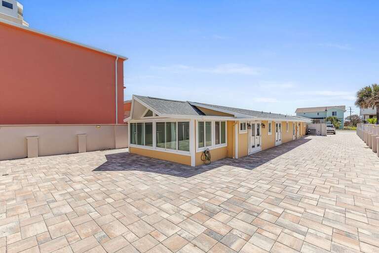 Relax at this inviting beach stay retreat featuring a large open patio, bright interiors, and coastal charm. Perfect for group getaways with easy beach access and plenty of space to unwind by the sea.