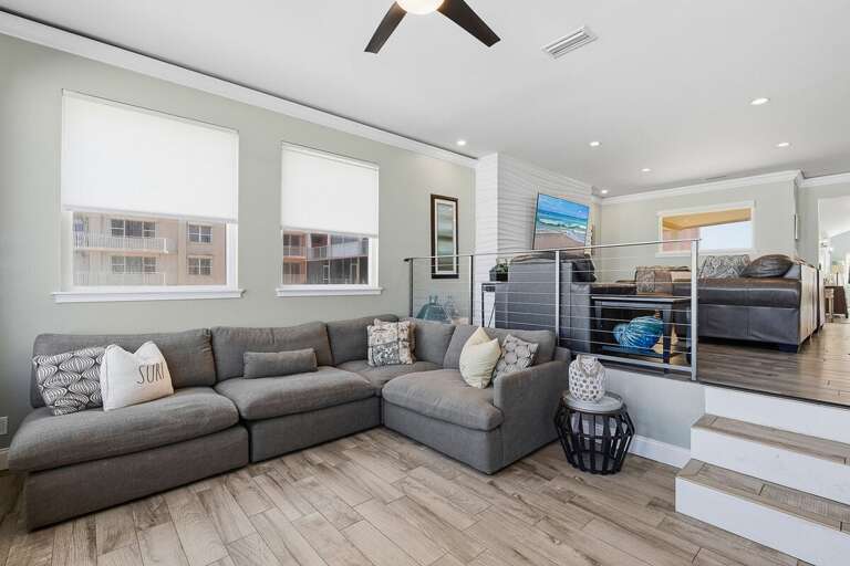 Stretch out in this roomy lounge with a large sectional and coastal touches. Perfect for your beach