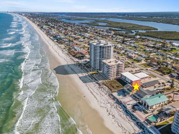 Exceptional beach stay located right on the shoreline with sweeping ocean views. Enjoy direct beach access, coastal surroundings, and the perfect setting for a relaxing seaside vacation getaway.