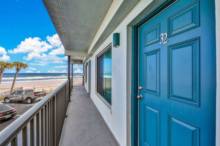 Step up to your beach stay getaway with this oceanfront entryway, just feet from the sand and surf. Enjoy stunning coastal views every time you walk to your door.
