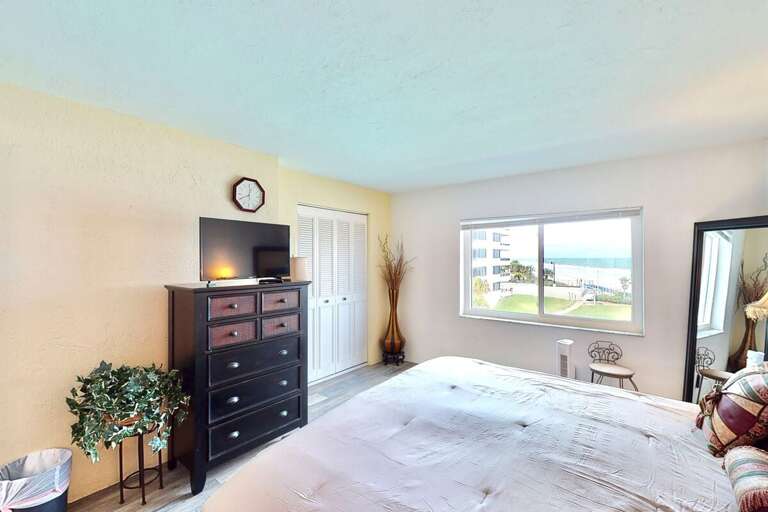 Wake up to peaceful ocean views in this bright beachside bedroom. Cozy furnishings and natural light create a relaxing retreat perfect for your beach stay.