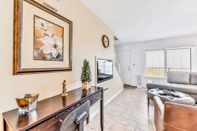 A welcoming spot to start your beach stay, featuring a cozy workspace and sunny seating area. Perfect for relaxing after a day on the sand or catching up on emails before heading back to the shore.