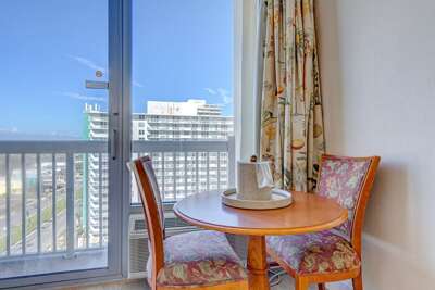 Seaside Sitting Space With Scenic Shore View, Featuring A Table For Two